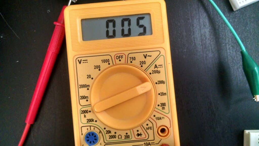 A multimeter showing readings