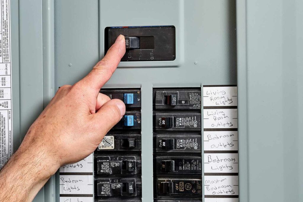 A person switching off the main circuit power