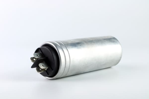 A view of an AC capacitor lying horizontally