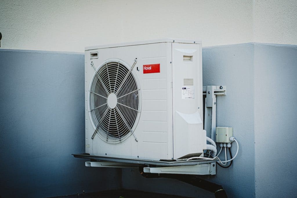 A view of an outer AC unit attached to a wall