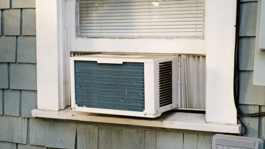 An ac seen outside a casement window