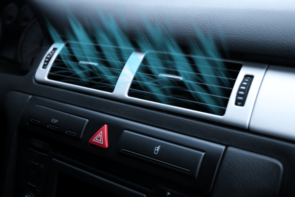 A view of a car ac with air waves decpicting cool breeze out of it