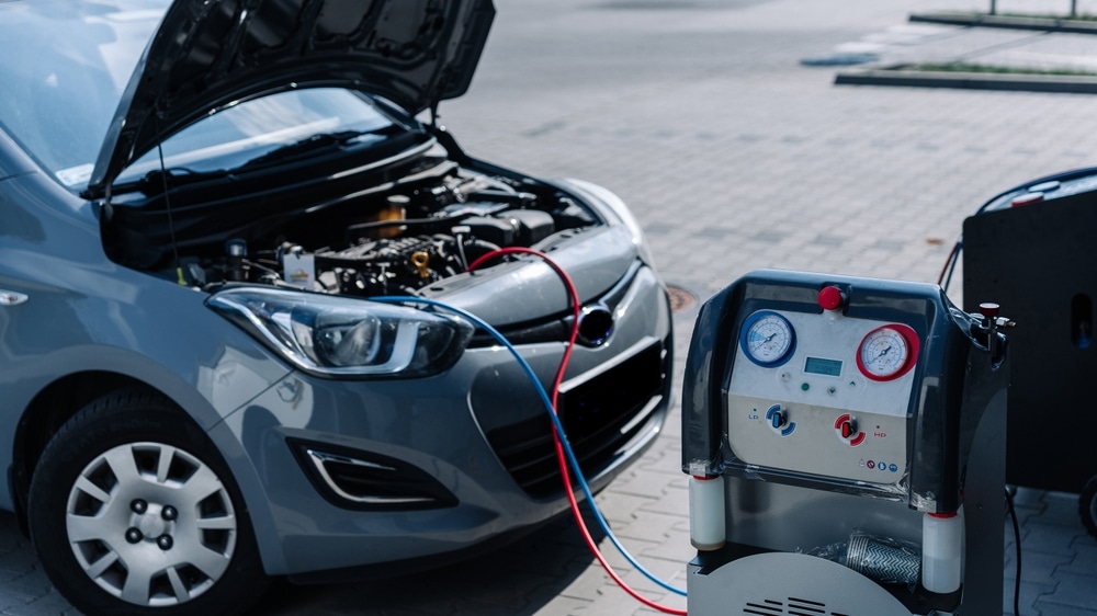 A view of gas being refilled inside a car