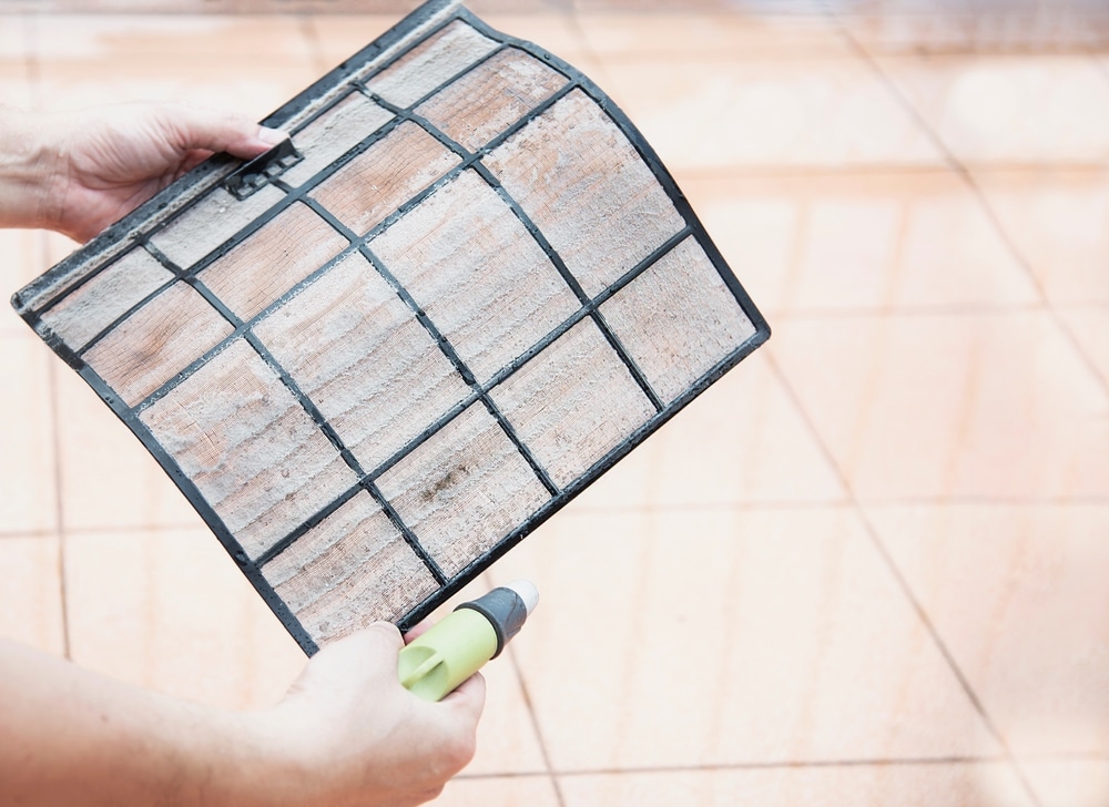 A view of an ac filter being cleaned